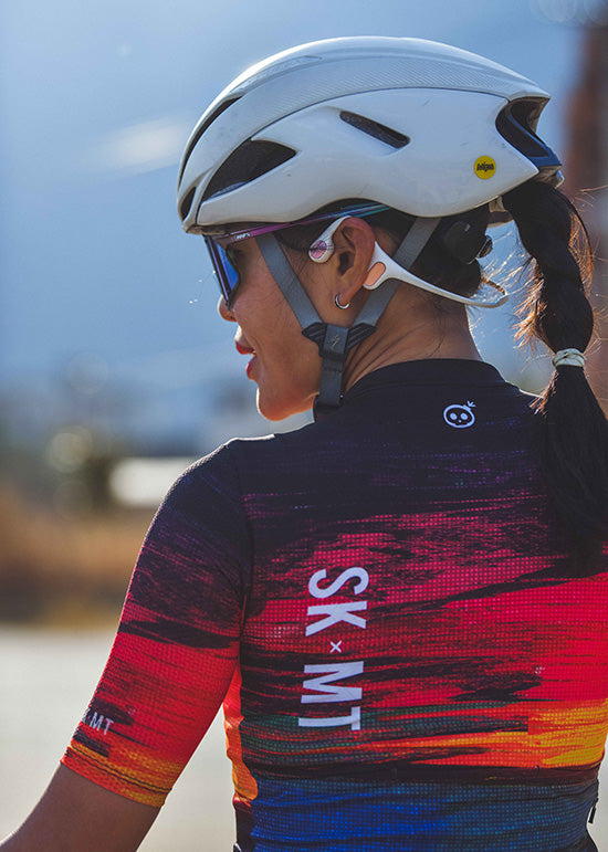 Monton URBAN Sunset Cycling Jersey with vibrant sunset-inspired colors, available in both men's and women's styles for stylish city cycling.
