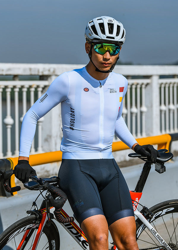 Male cyclist riding the Monton Vancouver long sleeve jersey in white